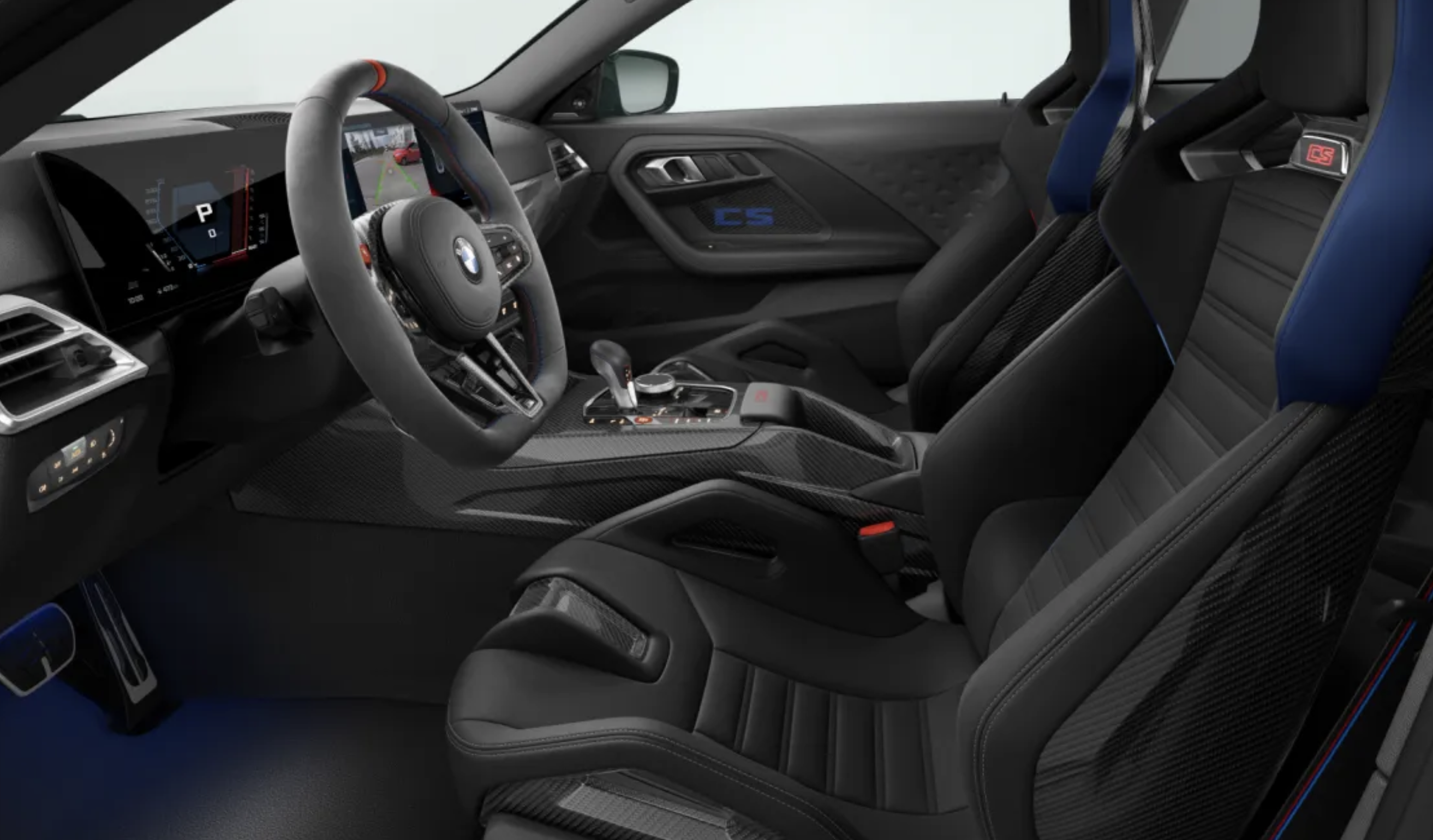 Interiér BMW M2 CS s karbonovými skořepinovými sedadly, Alcantara volantem a čalouněním Merino – detail na závodní kokpit.